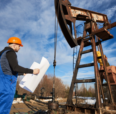 oil-man-controlling-work-pump-jack.png